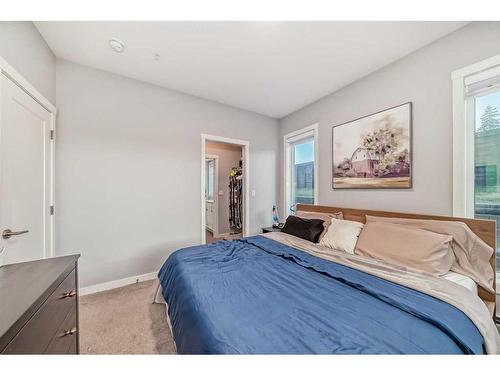 109-150 Shawnee Square Sw, Calgary, AB - Indoor Photo Showing Bedroom