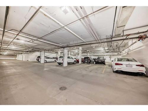 109-150 Shawnee Square Sw, Calgary, AB - Indoor Photo Showing Garage