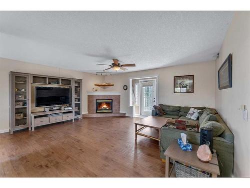 652 East Chestermere Drive, Chestermere, AB - Indoor Photo Showing Living Room With Fireplace