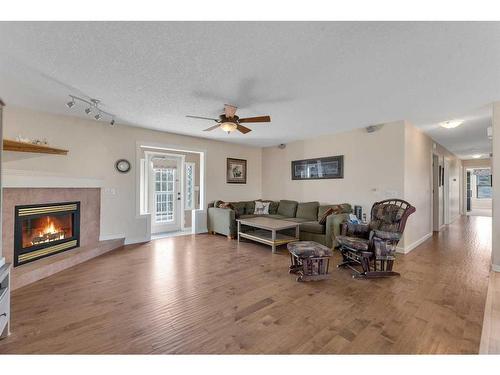 652 East Chestermere Drive, Chestermere, AB - Indoor Photo Showing Living Room With Fireplace