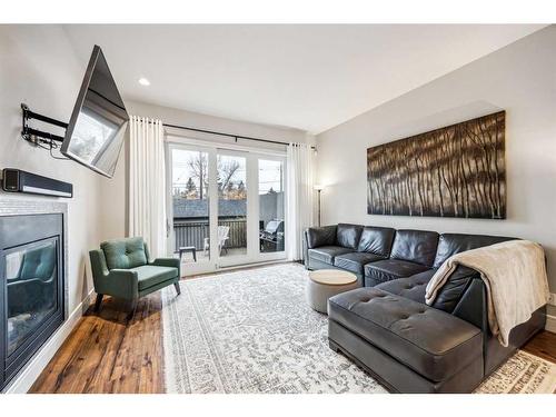 3327 44 Street Sw, Calgary, AB - Indoor Photo Showing Living Room With Fireplace