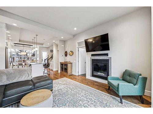 3327 44 Street Sw, Calgary, AB - Indoor Photo Showing Living Room With Fireplace