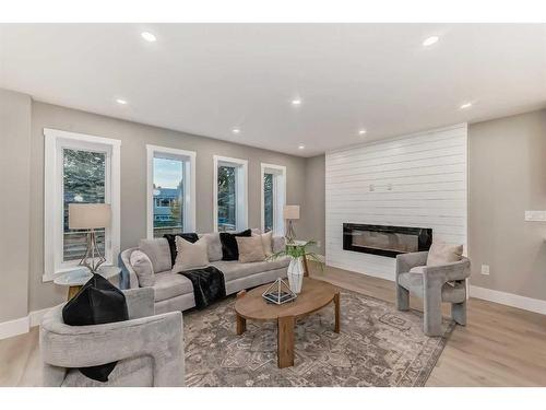 3315 Constable Place Nw, Calgary, AB - Indoor Photo Showing Living Room With Fireplace