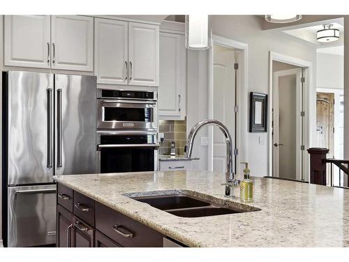 121 Spring Water Close, Heritage Pointe, AB - Indoor Photo Showing Kitchen With Double Sink With Upgraded Kitchen