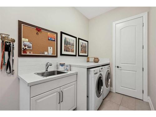 121 Spring Water Close, Heritage Pointe, AB - Indoor Photo Showing Laundry Room