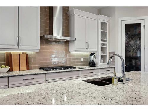 121 Spring Water Close, Heritage Pointe, AB - Indoor Photo Showing Kitchen With Double Sink With Upgraded Kitchen