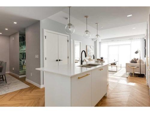 706-8505 Broadcast Avenue Sw, Calgary, AB - Indoor Photo Showing Kitchen With Double Sink With Upgraded Kitchen