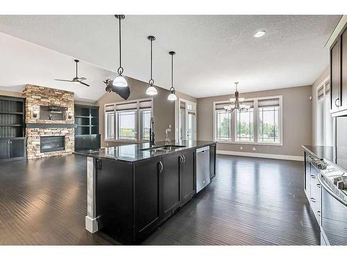 349050 Tamarack Drive East, Rural Foothills County, AB - Indoor Photo Showing Kitchen With Fireplace With Upgraded Kitchen