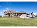 349050 Tamarack Drive East, Rural Foothills County, AB  - Outdoor With Facade 