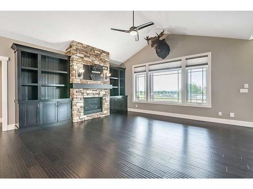 349050 Tamarack Drive East, Rural Foothills County, AB - Indoor Photo Showing Other Room With Fireplace