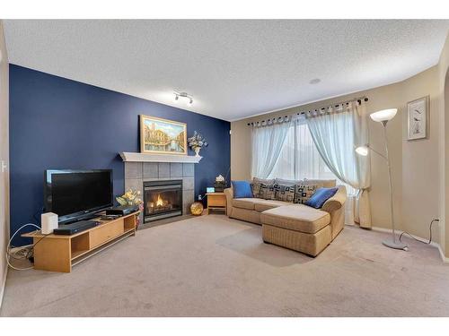 15 Saddletree Drive Ne, Calgary, AB - Indoor Photo Showing Living Room With Fireplace