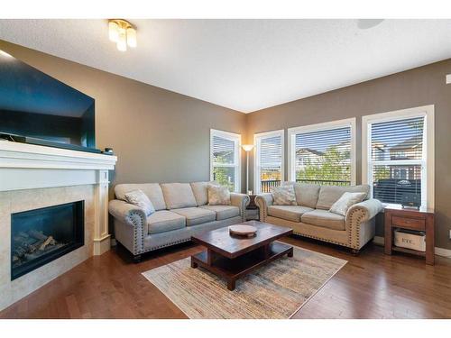 72 Silverado Skies Manor Sw, Calgary, AB - Indoor Photo Showing Living Room With Fireplace