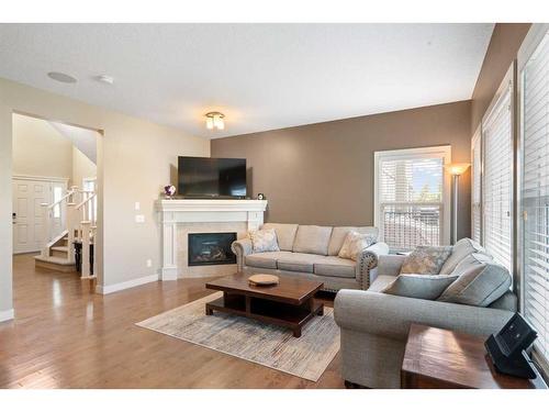 72 Silverado Skies Manor Sw, Calgary, AB - Indoor Photo Showing Living Room With Fireplace