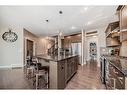 91 Sunset Park, Cochrane, AB  - Indoor Photo Showing Kitchen With Upgraded Kitchen 