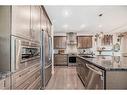 91 Sunset Park, Cochrane, AB  - Indoor Photo Showing Kitchen With Upgraded Kitchen 