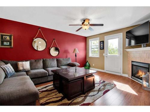 19 Tucker Circle, Okotoks, AB - Indoor Photo Showing Living Room With Fireplace