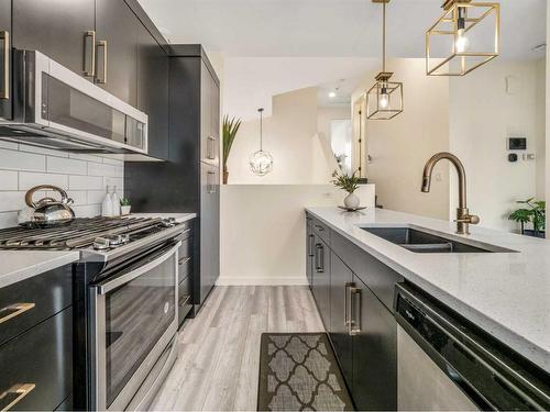 2700 46 Street South, Lethbridge, AB - Indoor Photo Showing Kitchen With Stainless Steel Kitchen With Double Sink With Upgraded Kitchen