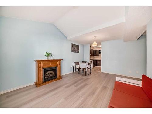 512-3500 Varsity Drive Nw, Calgary, AB - Indoor Photo Showing Living Room With Fireplace