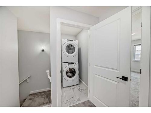 22 Amblehurst Way Nw, Calgary, AB - Indoor Photo Showing Laundry Room