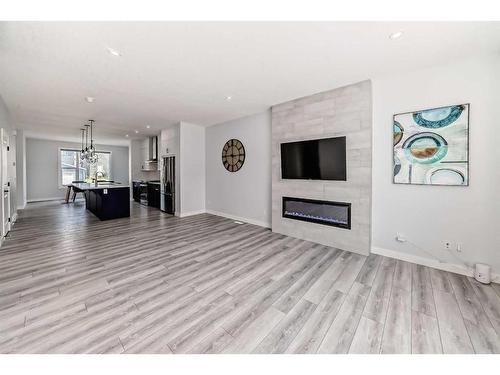 22 Amblehurst Way Nw, Calgary, AB - Indoor Photo Showing Living Room With Fireplace