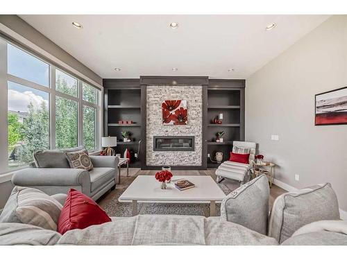 75 Aspen Summit Court Sw, Calgary, AB - Indoor Photo Showing Living Room With Fireplace