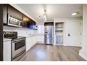 1203-829 Coach Bluff Crescent Sw, Calgary, AB  - Indoor Photo Showing Kitchen With Stainless Steel Kitchen 