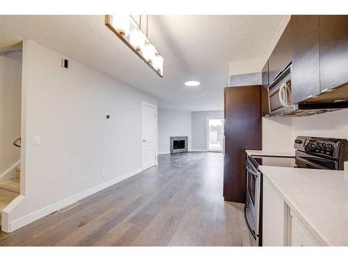 1203-829 Coach Bluff Crescent Sw, Calgary, AB - Indoor Photo Showing Kitchen