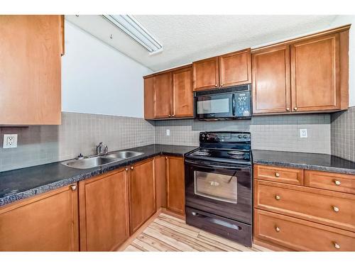 1024 Ranchview Road Nw, Calgary, AB - Indoor Photo Showing Kitchen With Double Sink