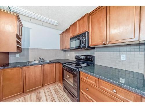 1024 Ranchview Road Nw, Calgary, AB - Indoor Photo Showing Kitchen With Double Sink