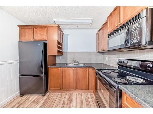 1024 Ranchview Road Nw, Calgary, AB - Indoor Photo Showing Kitchen With Double Sink