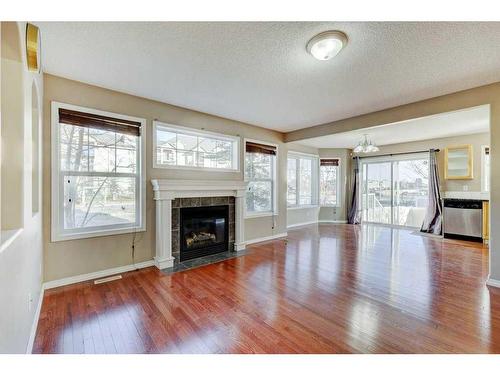 130 Royal Birch Mount Nw, Calgary, AB - Indoor Photo Showing Living Room With Fireplace