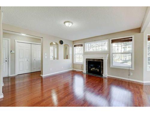 130 Royal Birch Mount Nw, Calgary, AB - Indoor Photo Showing Living Room With Fireplace