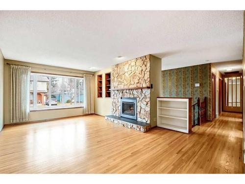 5131 Veronica Road Nw, Calgary, AB - Indoor Photo Showing Living Room With Fireplace