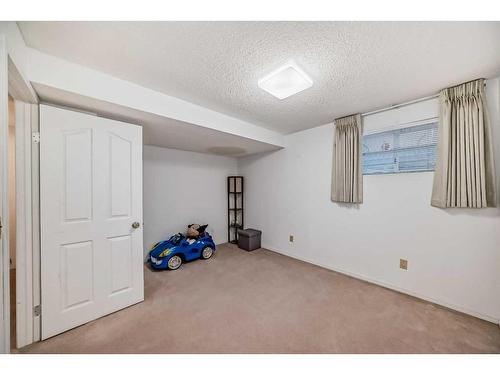 8-388 Sandarac Drive Nw, Calgary, AB - Indoor Photo Showing Other Room