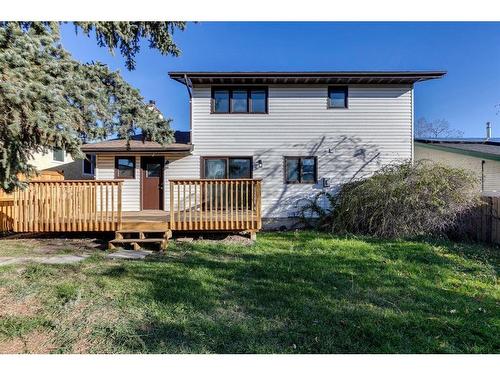 7 Woodmont Way Sw, Calgary, AB - Outdoor With Deck Patio Veranda