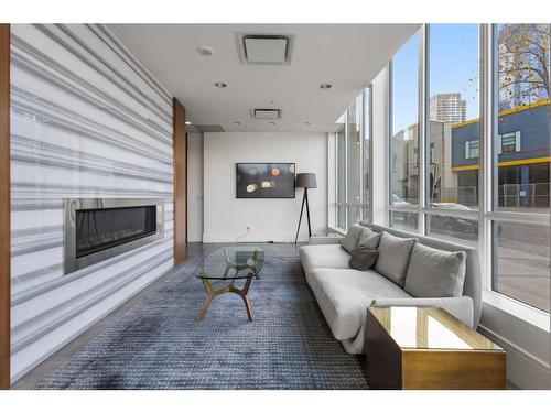 608-128 2 Street Sw, Calgary, AB - Indoor Photo Showing Living Room With Fireplace