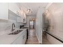 67-2727 Rundleson Road Ne, Calgary, AB  - Indoor Photo Showing Kitchen With Double Sink 