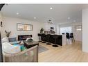 9339 Allison Drive Se, Calgary, AB  - Indoor Photo Showing Living Room 