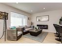 9339 Allison Drive Se, Calgary, AB  - Indoor Photo Showing Living Room With Fireplace 