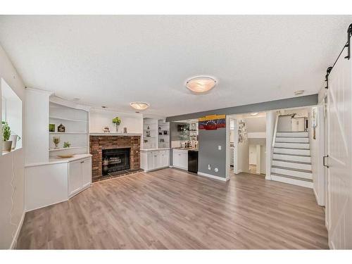 23 Sanderling Rise Nw, Calgary, AB - Indoor Photo Showing Other Room With Fireplace