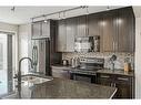 610 Cranford Court Se, Calgary, AB  - Indoor Photo Showing Kitchen With Double Sink With Upgraded Kitchen 