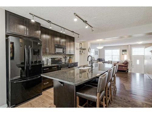 610 Cranford Court Se, Calgary, AB - Indoor Photo Showing Kitchen With Double Sink