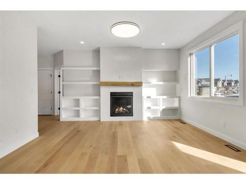 18 Ranchers Bay, Okotoks, AB - Indoor Photo Showing Living Room With Fireplace