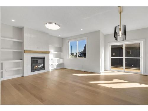 18 Ranchers Bay, Okotoks, AB - Indoor Photo Showing Living Room With Fireplace