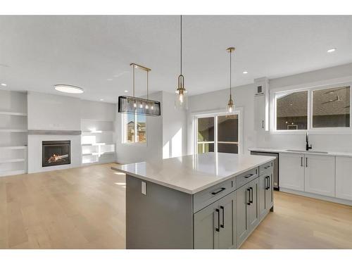 18 Ranchers Bay, Okotoks, AB - Indoor Photo Showing Kitchen With Fireplace With Upgraded Kitchen