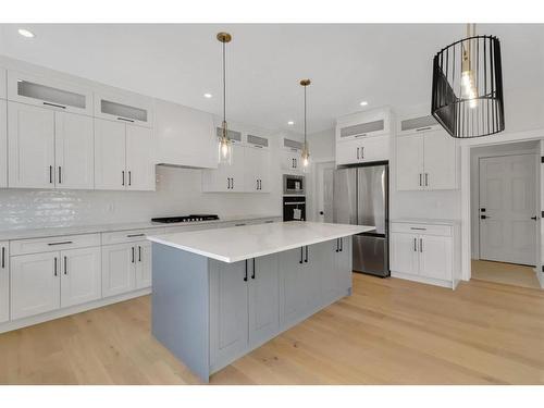 18 Ranchers Bay, Okotoks, AB - Indoor Photo Showing Kitchen With Upgraded Kitchen