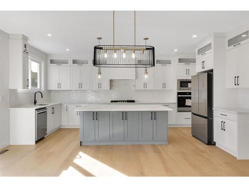 18 Ranchers Bay, Okotoks, AB - Indoor Photo Showing Kitchen With Stainless Steel Kitchen With Upgraded Kitchen