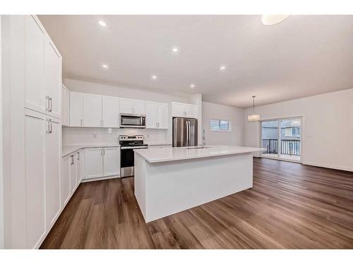 1034 Thimbleberry Hill Sw, Airdrie, AB - Indoor Photo Showing Kitchen With Upgraded Kitchen