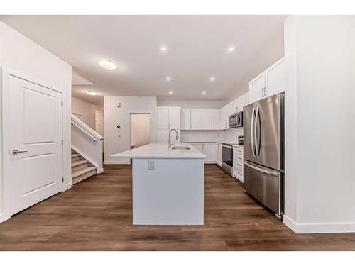 1034 Thimbleberry Hill Sw, Airdrie, AB - Indoor Photo Showing Kitchen