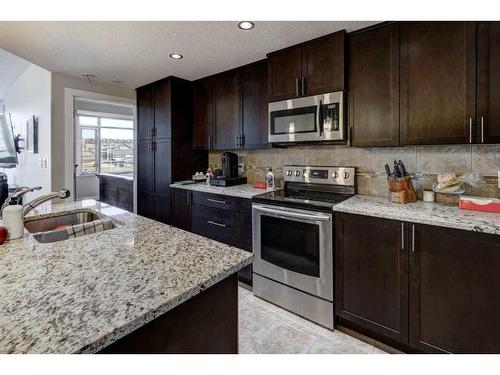 401-24 Varsity Estates Circle Nw, Calgary, AB - Indoor Photo Showing Kitchen With Double Sink With Upgraded Kitchen